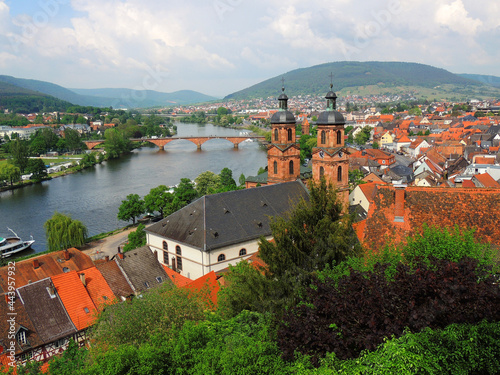 panoramic view  in  early summer of  the main river and charming  st. james' church in miltenberg, germany   photo