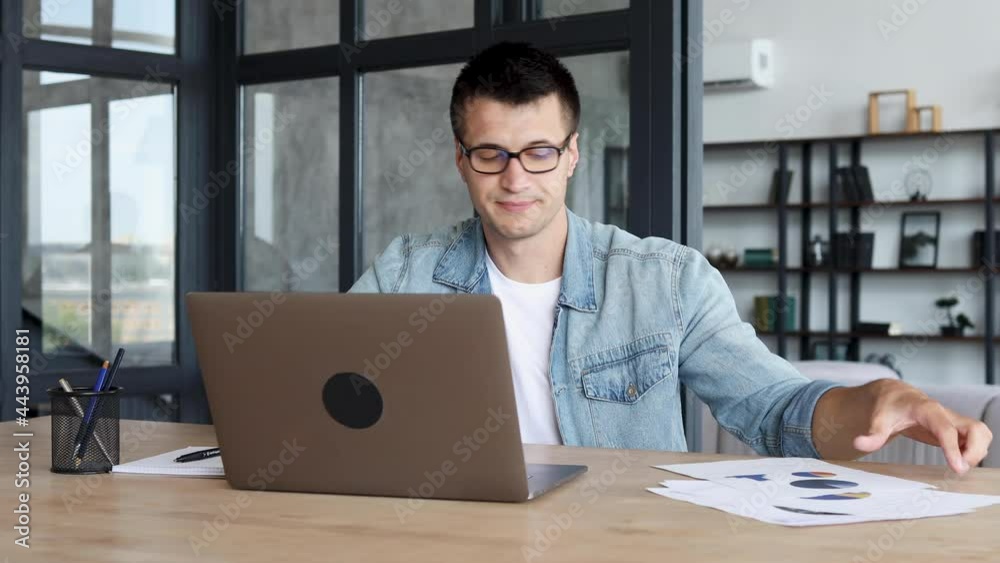 Businessman, ceo using laptop to analyze sales report with employees. Successful caucasian man uses computer for online communication with colleagues sitting in the office Businessman, ceo using laptop to analyze sales report with employees. Successful caucasian man uses computer for online communication with colleagues sitting in the office