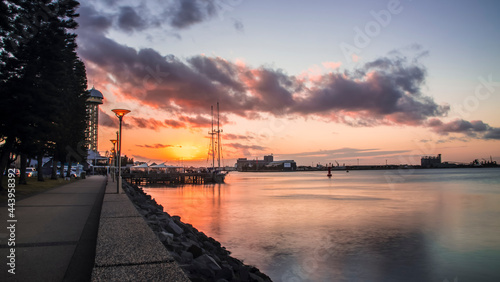 Warm and golden sunset glow over the Newcastle Foreshore just before dusk. © gshakwon