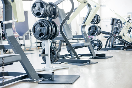 Weight Training Equipment On Sport Gym. power, strength, healthy lifestyle concept