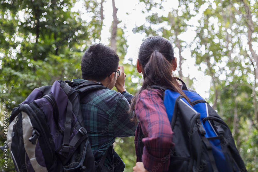 Couple asian backpacker travel in the forest with relax, Concept Travel Couple asian backpacker travel in the forest with relax, Concept Travel