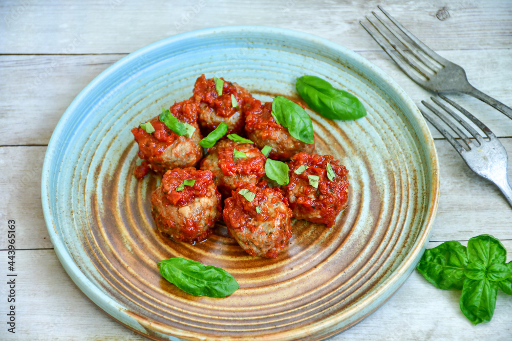 Tasty home made italian dish mini meatballs baked in marinara tomato sauce Tasty home made italian dish mini meatballs baked in marinara tomato sauce