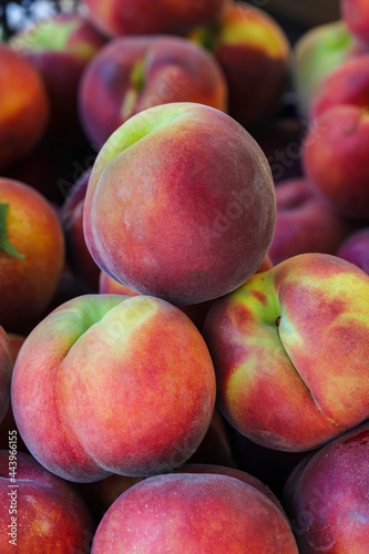 close-up ripe peaches on the market stall