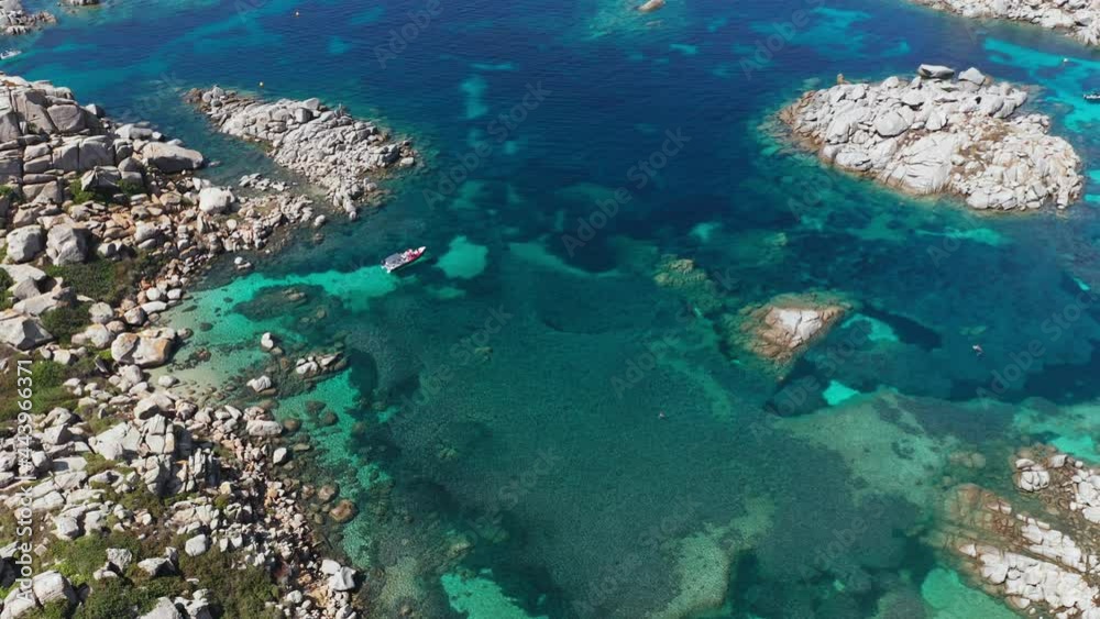 Aerial view of white sand beach, blue sea, marine vegetation,waves,trees and white rocks. abstract sea green shades coral reef background with boat. Tropical coral reef turquoise water texture. Aerial view of white sand beach, blue sea, marine vegetation,waves,trees and white rocks. abstract sea green shades coral reef background with boat. Tropical coral reef turquoise water texture.