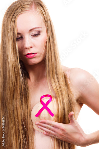 Woman chest in bra, pink cancer ribbon © Voyagerix