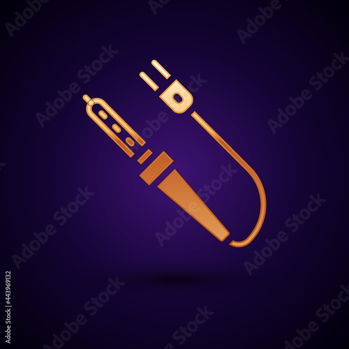 Gold Soldering iron icon isolated on black background. Vector
