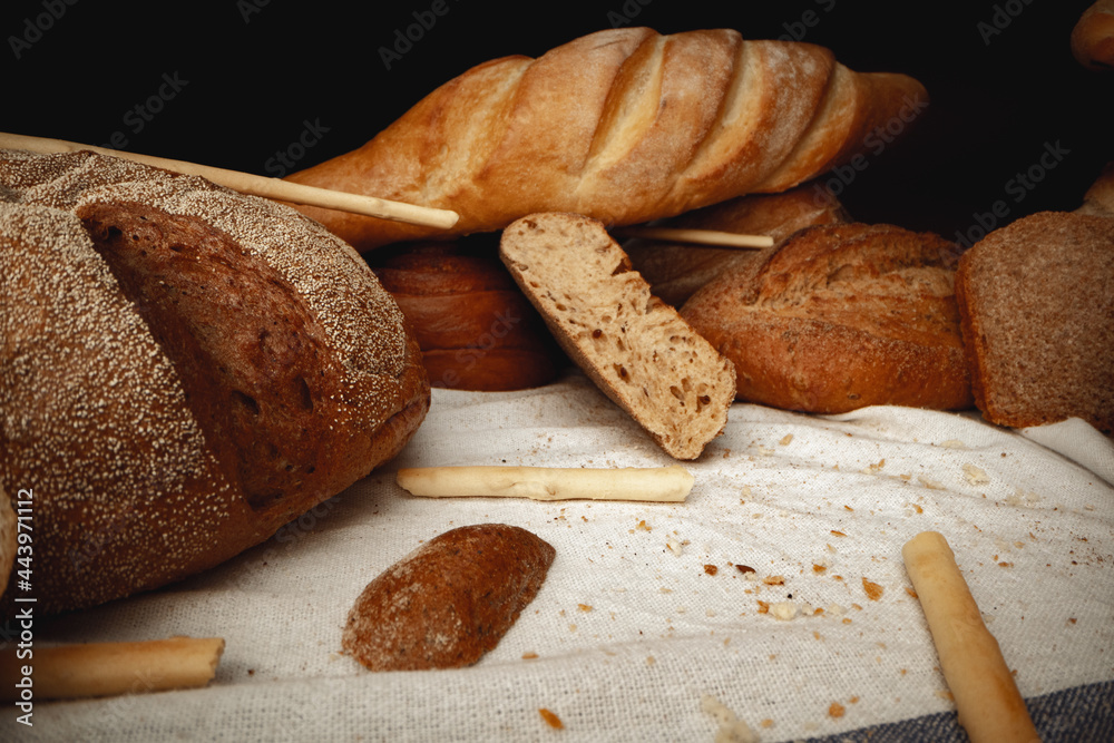 Variety of bread on tablecloth close up