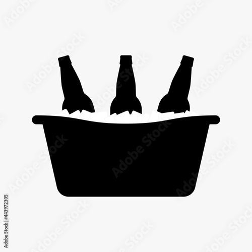 Beer bottles in a metal tub with ice cubes. Black silhouette. Vector picture and simple icon.