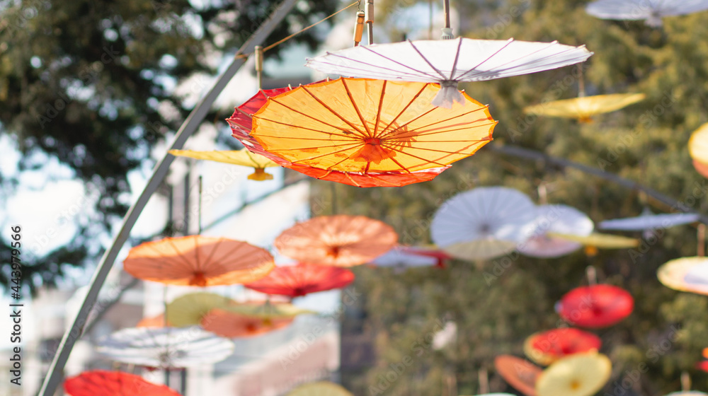 Many colorful umbrellas in the city.