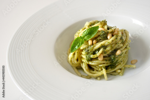 Pasta spaghetti with pesto genovese on white background 