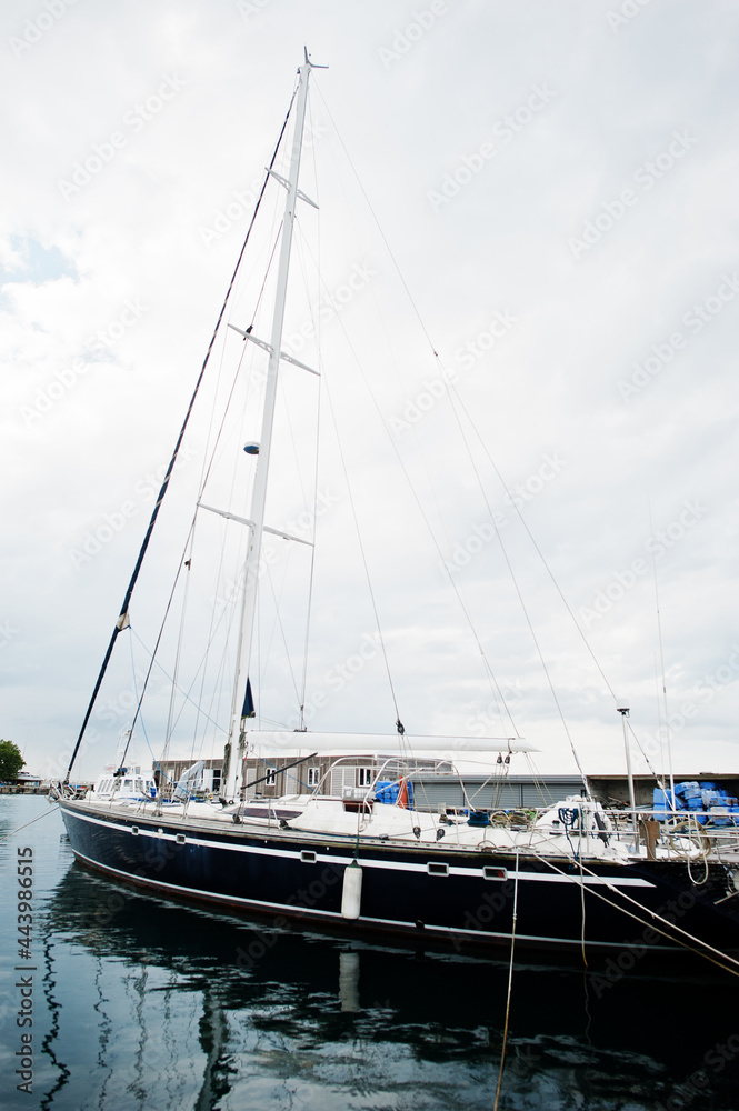 Fototapeta premium Marine parking of modern motor boats. Luxury yachts docked in sea port.