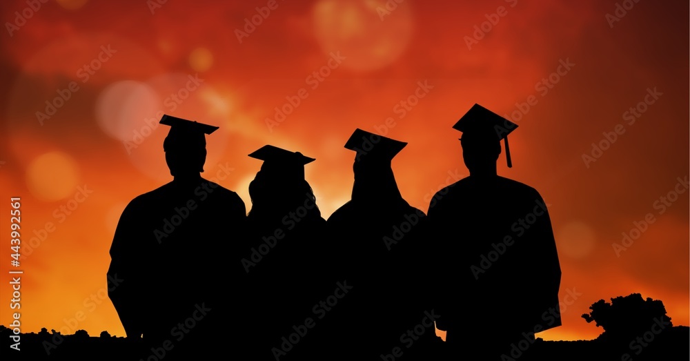 Composition of silhouettes of graduating students in caps and gowns against sunset sky