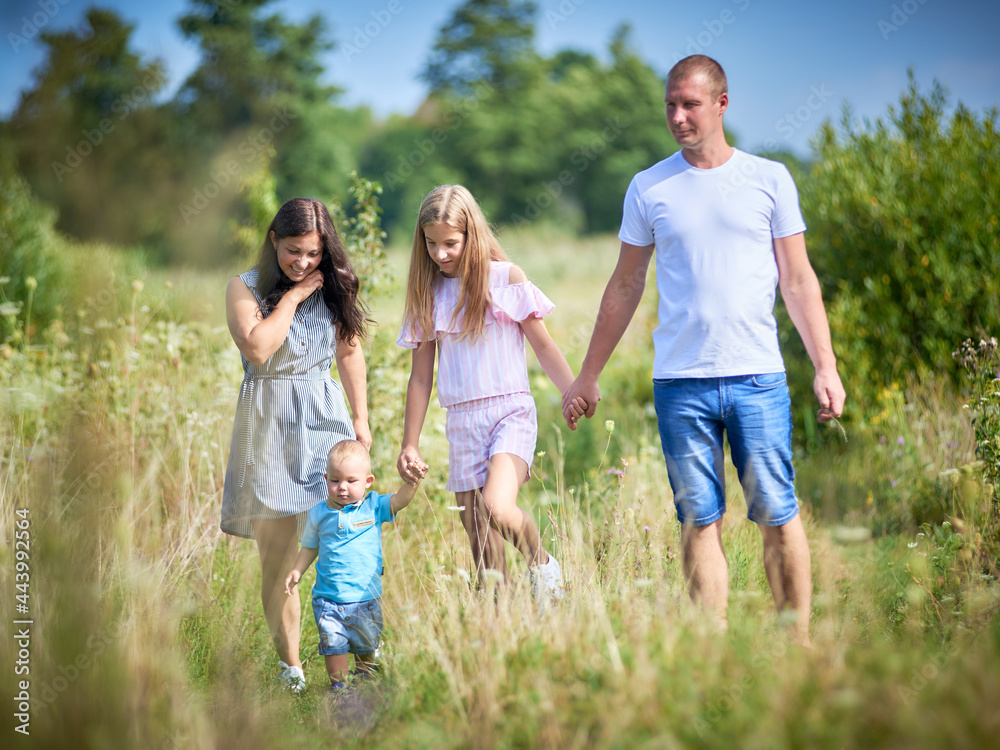 Outdoor portrait of family with two children