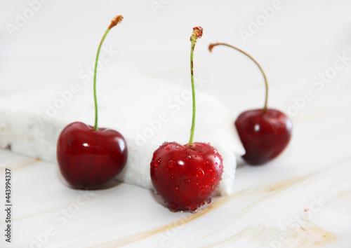 natural red cherry on a marble stone