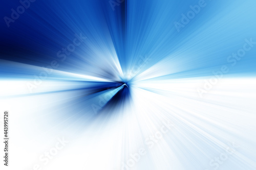 Abstract radial blur surface in in dark blue, light blue and white tones. Abstract blue background with radial, radiating, converging lines. 