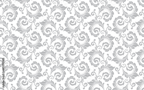 Wallpaper in the style of Baroque. Seamless vector background. White and gray floral ornament. Graphic pattern for fabric, wallpaper, packaging. Ornate Damask flower ornament.