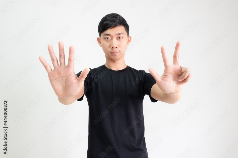 Young asian man black shirt count one to ten by hand half body on white