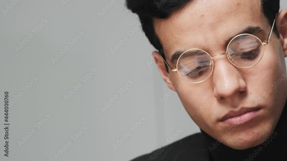 A close-up view of a concentrated arabian man is working in the office A close-up view of a concentrated arabian man is working in the office
