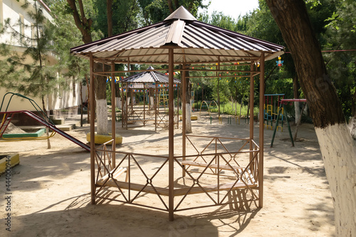 Wallpaper Mural Iron gazebo in brown color on the children's playground Torontodigital.ca