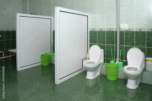 Wallpaper Mural Bathroom and toilet in the kindergarten, the walls are made of green tiles Torontodigital.ca