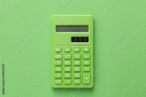 Green Calculator on Green background photo