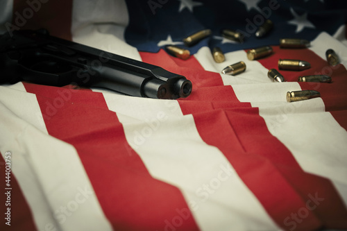 A gun placed on the Star-Spangled Banner. photo