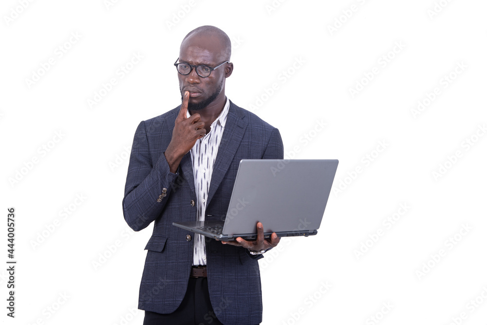 handsome pensive businessman working on laptop. handsome pensive businessman working on laptop.