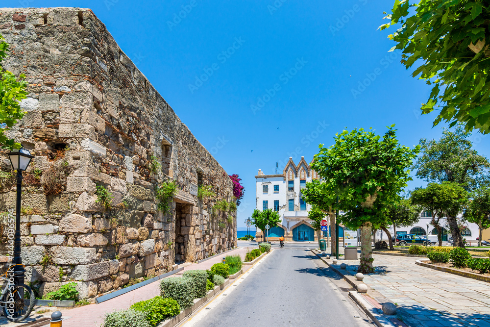 Ancient Roman Agora wall and colorful street view in Kos Town 