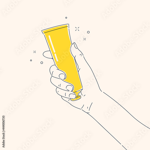 The girl squeezes the cream out of the tube into the palm of her hand. Natural cosmetics for women.