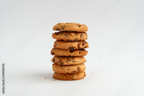 Stack of chips chocolate cookies isolated on white background. Close up.