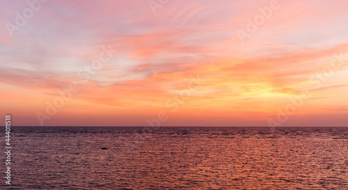 Fiery orange sunset sky. Beautiful sky. Baltic sea and beautiful sky with clouds before sunrise