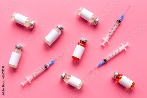 Medicine bottle for injection. Coronavirus vaccine ampoules with syringe