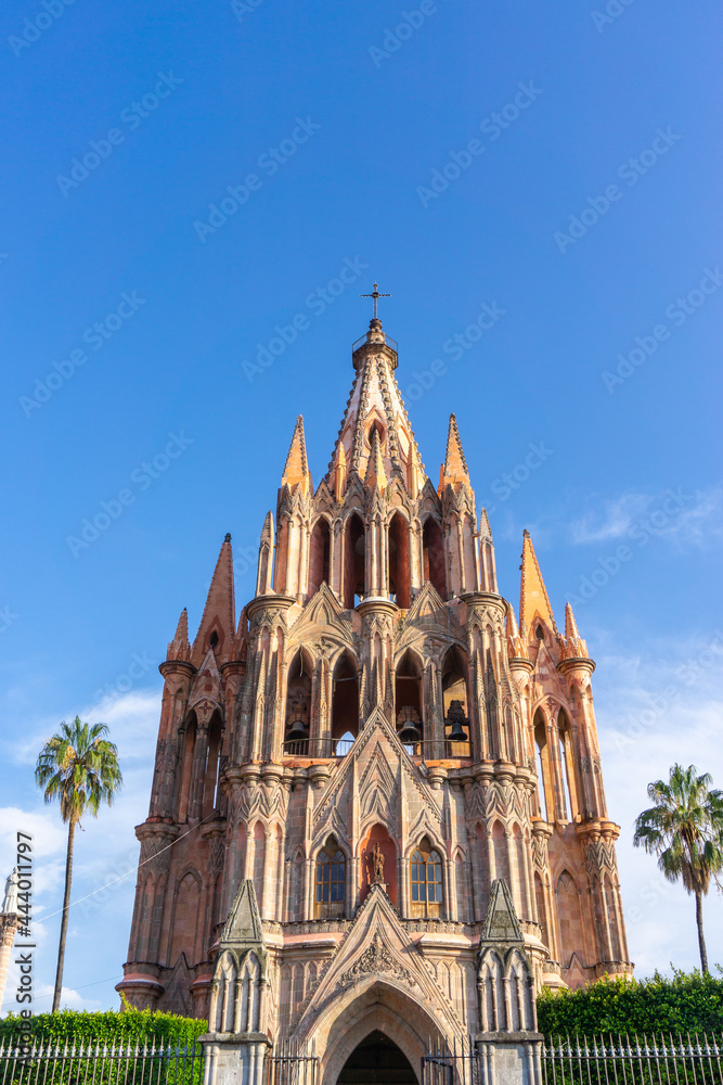 Fototapeta premium Looking up at the Archangel Parish of San Miguel under blue sky