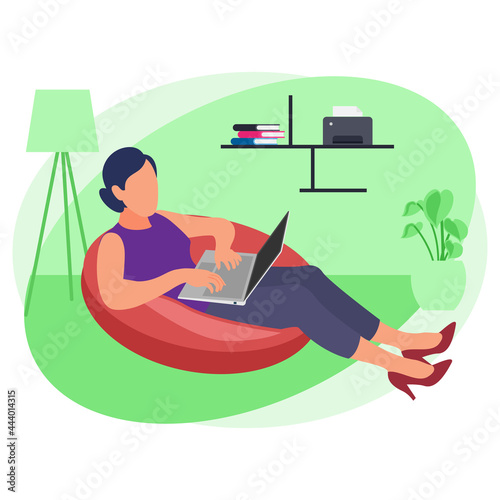 Girl working from home while seating on beanbag