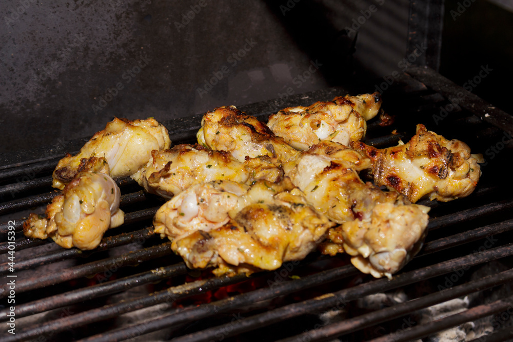 Tasty Chicken thighs roasted on the barbecue. Gastronomic photography restaurants and steakhouses.