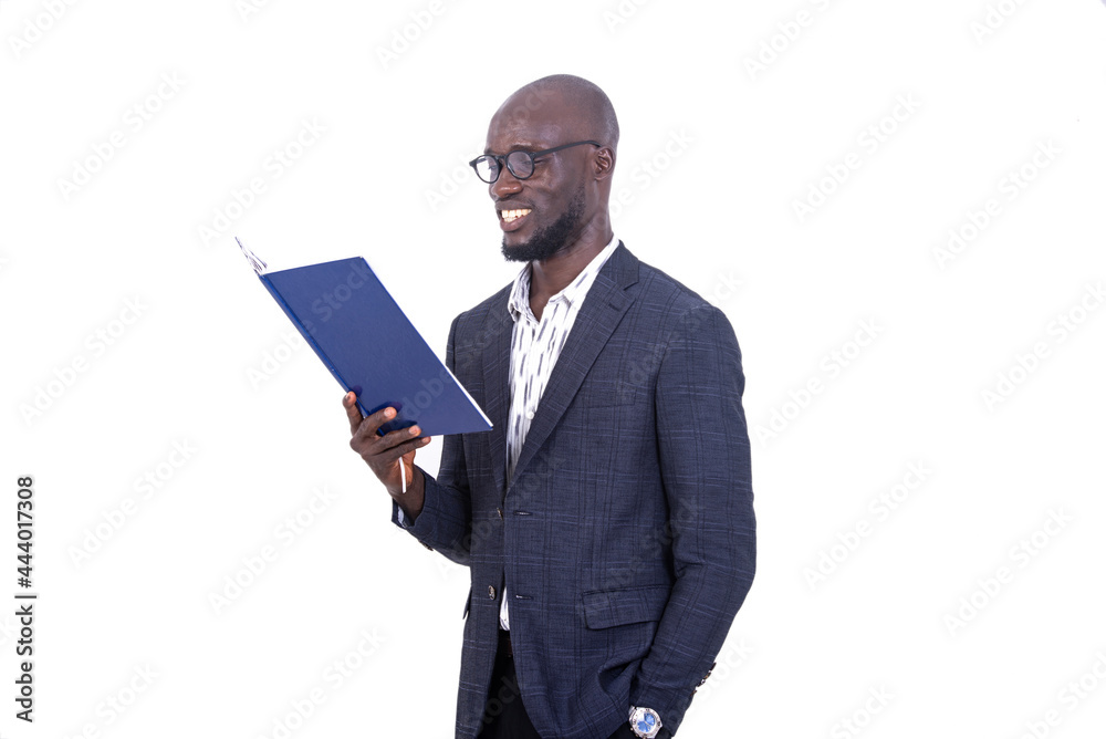 adult businessman reading a document while smiling. adult businessman reading a document while smiling.
