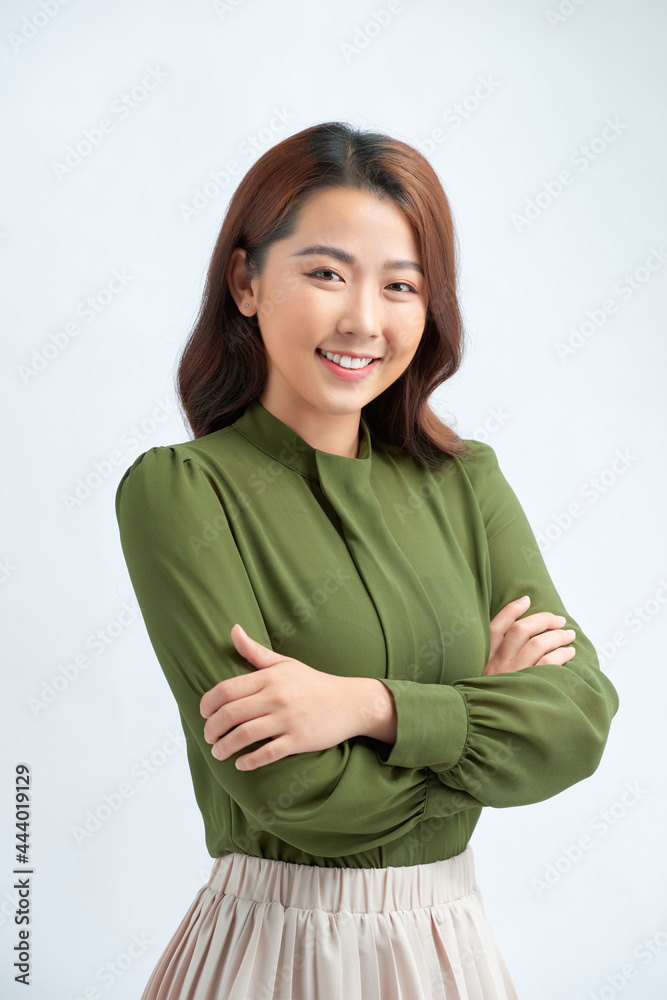 Young woman over isolated background keeping the arms crossed in frontal position Young woman over isolated background keeping the arms crossed in frontal position