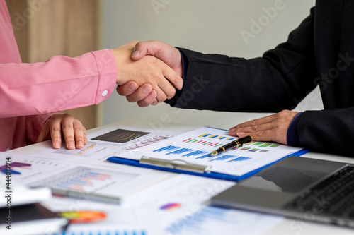 Close up of marketing manager employee pointing at business document,Brainstorming stock market investment plans,With statistical data showing profits and income teamwork concept.