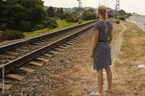 Crossing the railway tracks across the railway tracks in the daytime. Safety concept for road users