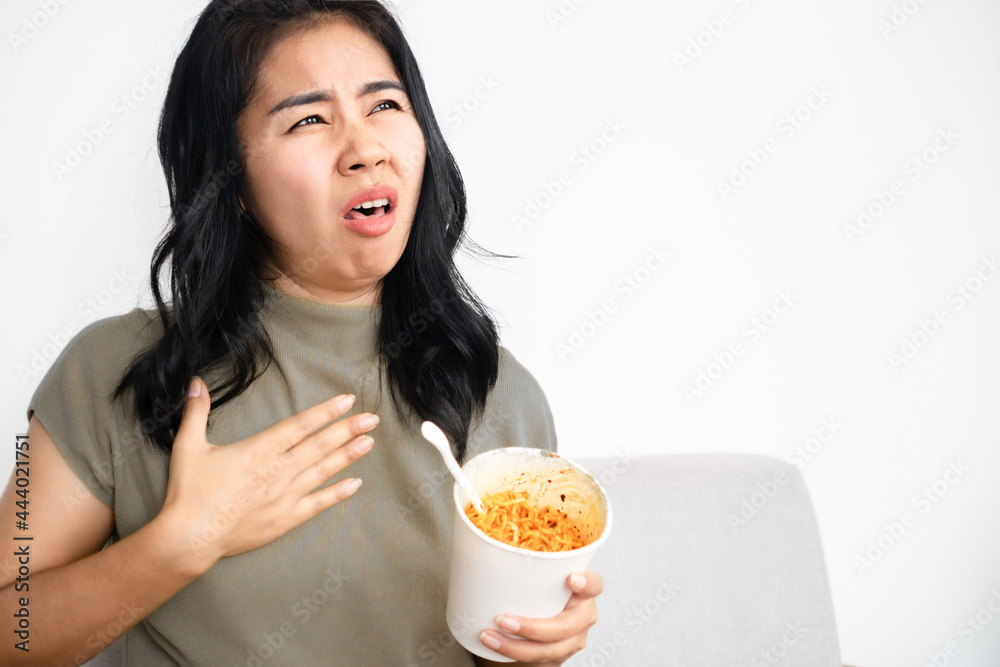 Asian woman suddenly choking while eating noodle that stuck in her throat, she tries to open her mouth to breathe Asian woman suddenly choking while eating noodle that stuck in her throat, she tries to open her mouth to breathe