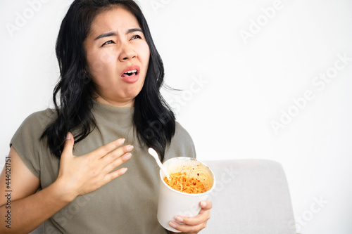 Asian woman suddenly choking while eating noodle that stuck in her throat  she tries to open her mouth to breathe