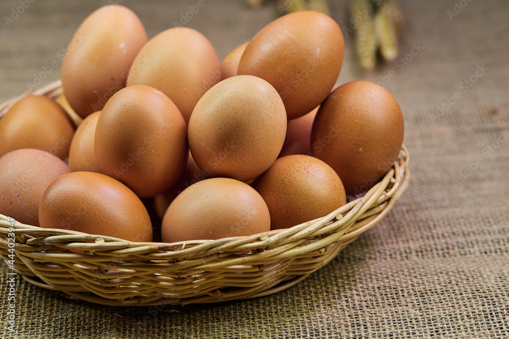 closeup chicken eggs in a wicker basket isolate on the table closeup chicken eggs in a wicker basket isolate on the table