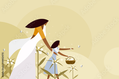 Traditionally dressed mother and daughter collecting flowers from outdoor. Concept of Onam festival in Kerala