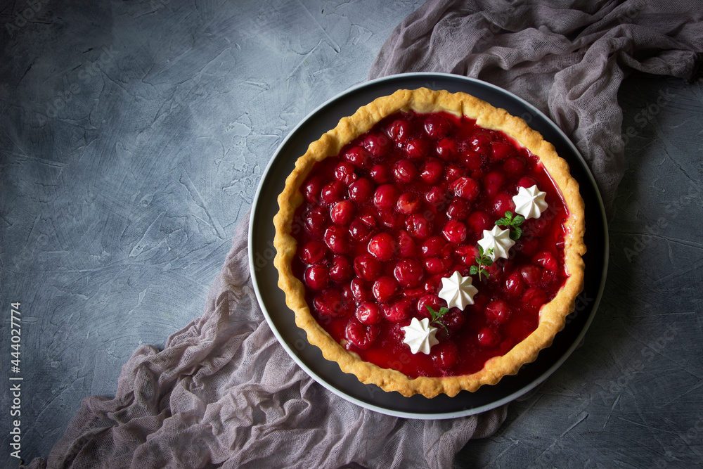Cherry Tart , sweet pie , cake with jellied fresh cherries. Dessert with red berries on dark background