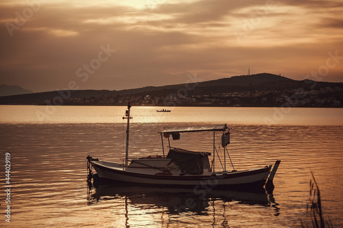 Evening sea with fishing boats. Sunset time and calm sea waters