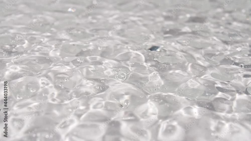 Macro Shot of air Bubbles in Transparent Cosmetic Liquid Gel Cream. Fluid texture With Bubbles. Slow motion . High quality 4k footage Macro Shot of air Bubbles in Transparent Cosmetic Liquid Gel Cream. Fluid texture With Bubbles. Slow motion . High quality 4k footage