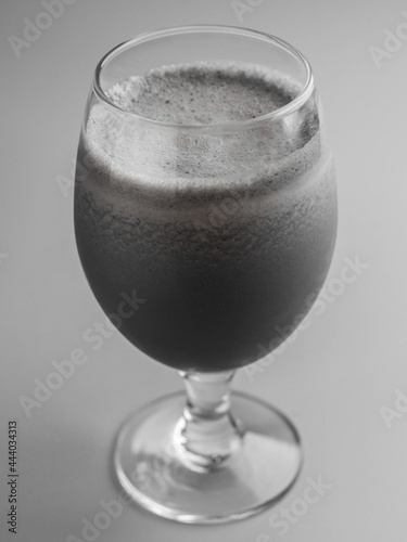 Black milkshake in a glass 