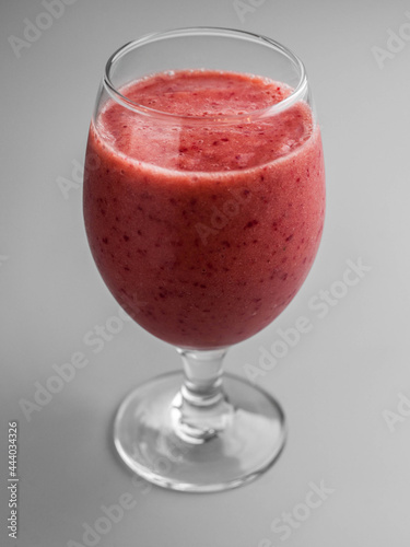 Delicious cold smoothie with cherries in a glass