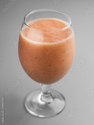 Cold smoothie with strawberries in a glass
