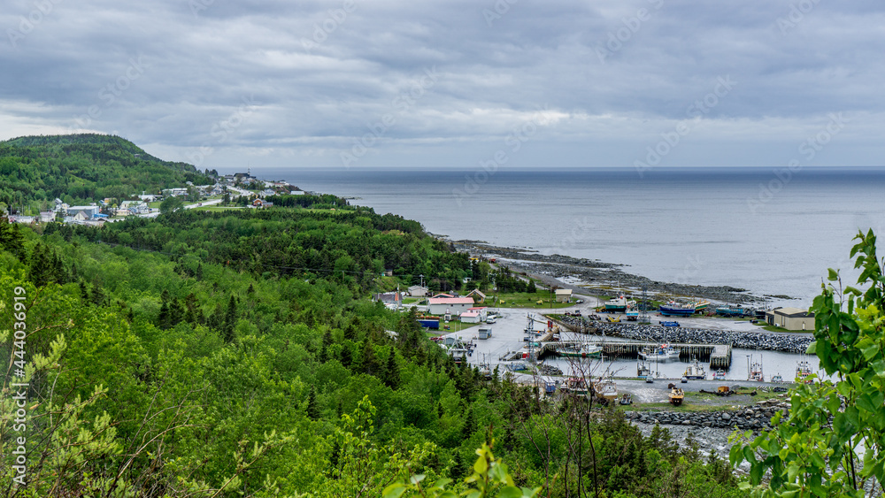 View on the small village of La Martre and the St Lawrence river from the lighthouse, this is near the scenic route 132, on the northern shore of the Gaspesie Peninsula, in Quebec (Canada)